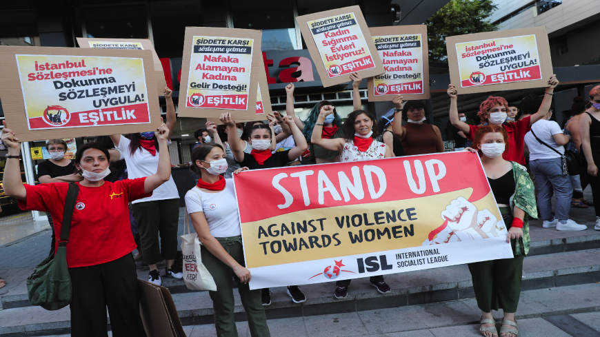 Women wearing face masks hold signs in Ankara, on August 5, 2020, during a demonstration to demand the government not withdraw from the Istanbul Convention, a landmark treaty on preventing domestic violence. The protests were the biggest in recent weeks as anger grows over the rising number of women killed by men in the past decade since the Istanbul Convention. The treaty's official title is the Council of Europe Convention on Preventing and Combating Violence Against Women and Domestic Violence, agreed up