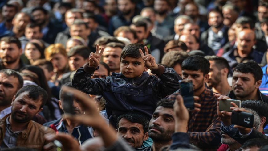 A young participant flashes the victory sign in front of the municipality headquarters in Diyarbakir, southeastern Turkey, on October 30, 2016, during a pro-Kurdish demonstration. A Turkish court has barred Figen Yuksekdag, a leader of the main pro-Kurdish party, from leaving the country, accusing her of "belonging to an armed terrorist organisation," the state-run Anadolu news agency reported on October 29, 2016. The HDP denounced the decision as "totally arbitrary" and said it would appeal. President Erdo