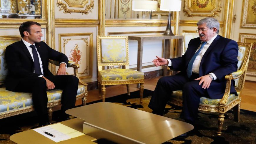 French President Emmanuel Macron meets Algerian Prime Minister Ahmed Ouyahia at the Elysee presidential palace before the opening of an international congress on Libya, Paris, France, May 29, 2018. 