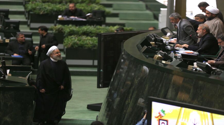 Iran's President Hassan Rouhani (L) arrives to address parliament in the capital, Tehran, on Sept. 3, 2019. 