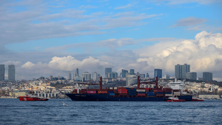 A Liberian-flagged cargo vessel is tugged by a coastal safety boat after it ran ashore in the Bosporus, Istanbul, Turkey, Dec. 27, 2019. 