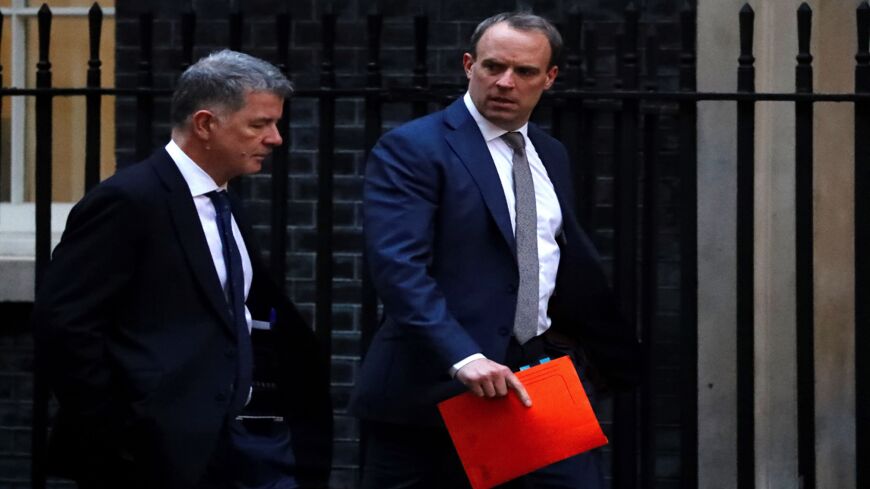 Britain's Foreign Secretary and First Secretary of State Dominic Raab (R) walks from the Foreign Office toward 10 Downing Street in central London on Jan. 6, 2020. The leaders of Germany, France and Britain on Sunday urged Iran to drop measures that go against the 2015 nuclear deal after Tehran announced it would no longer abide by a limit on enrichment.