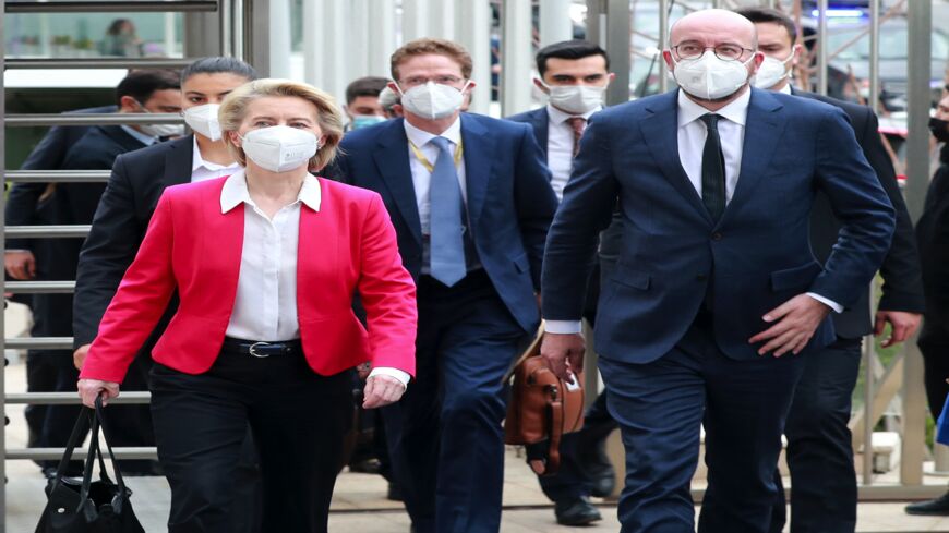 European Commission President Ursula von der Leyen (L) and EU Council President Charles Michel (R) arrive for a joint news conference after talks with Turkey's president in Ankara on April 6, 2021.