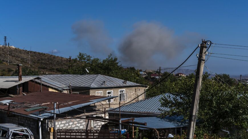 Smoke from a presumed drone or artillery strike on Oct. 3, 2020, in Stepanakert, Nagorno-Karabakh. 