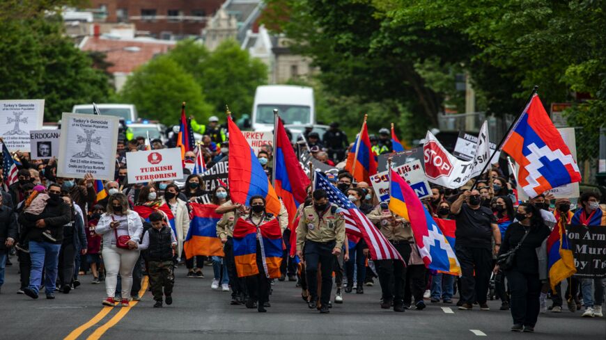 Supporters of Armenian stand off with Turkish supporters outside the Turkish Embassy on April 24, 2021, in Washington, DC. President Joe Biden became the first US president to formally refer to atrocities committed against Armenians as a “genocide” on Saturday, 106 years after the 1915 start of an eight-year-long campaign of ethnic cleansing.