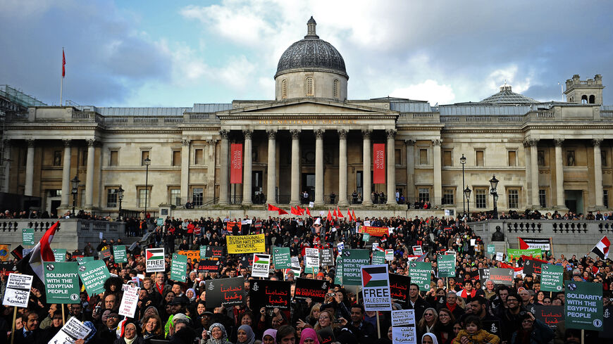 Protesters are pictured during a global solidarity demonstration for political change in Egypt in Trafalgar square, London, United Kingdom, Feb. 12, 2011. The event was organized by Amnesty international and the ITUC, Human Rights Watch, the NUS, the Cairo Institute for Human Rights Studies, the Egyptian Initiative for Personal Rights, the Euro-Mediterranean Human Rights Network and the Arab Program for Human Rights Activists.