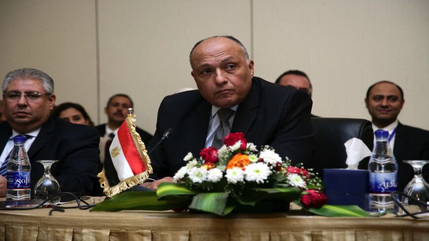 Egyptian Foreign Minister Sameh Shoukry (C) looks on during another round of talks on the Grand Ethiopian Renaissance Dam (GERD) project that has strained ties between Cairo and Addis Ababa in the Sudanese capital, Khartoum, on Dec. 29, 2015. 