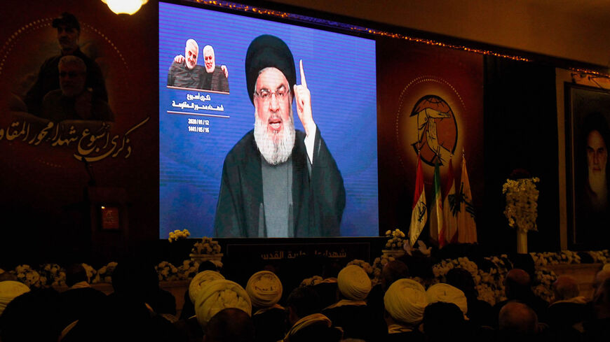 Supporters of the Shiite Hezbollah movement watch as the movement's leader Hassan Nasrallah delivers a speech on a screen in the southern city of Nabatieh, Lebanon, Jan. 12, 2020.