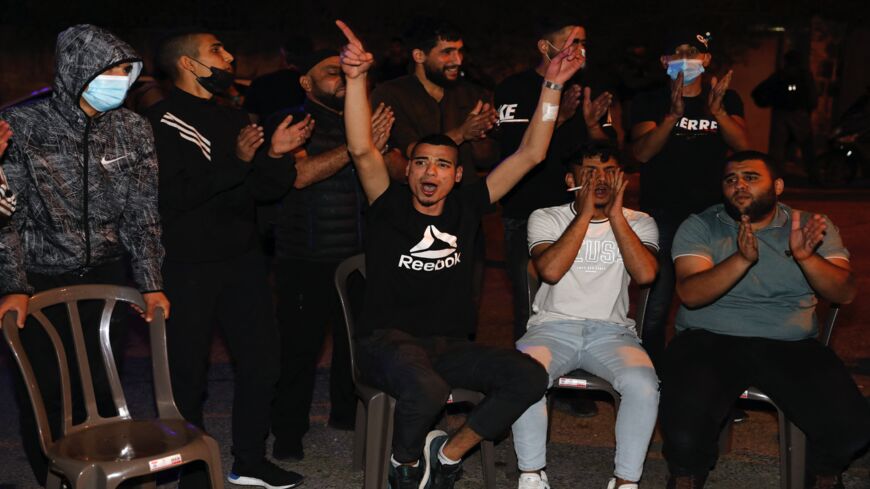 Palestinians protest amid ongoing confrontations as Palestinian families face eviction in the Sheikh Jarrah neighbourhood of East Jerusalem, on May 4, 2021. Israeli Jews backed by courts have taken over houses in Sheikh Jarrah in East Jerusalem on the grounds that Jewish families lived there before fleeing in Israel's 1948 war for independence. The claimants seek to evict a total of 58 more Palestinians, according to the watchdog group Peace Now, and Israel's Supreme Court is set to announce a decision for 