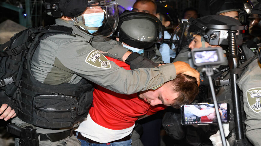 A Palestinian demonstrator is arrested by Israeli security forces, as Palestinian families face eviction, part of an ongoing effort by Jewish Israelis to take control of homes in the Sheikh Jarrah neighborhood of occupied East Jerusalem, May 5, 2021.