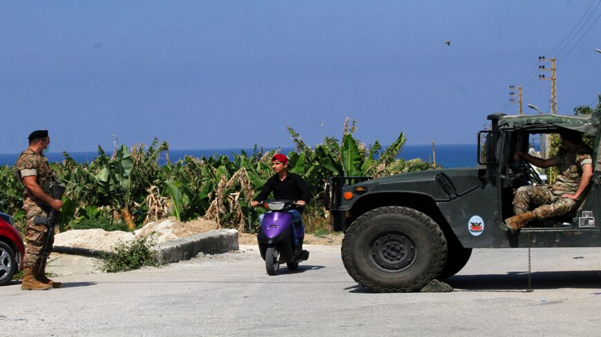 Lebanese soldiers stand guard in the southern Lebanese town of Qlaile on May 14, 2021. Three rockets were fired from southern Lebanon toward Israel, a Lebanese military source said. Israel's army confirmed the attack and said the rockets landed in the sea. 