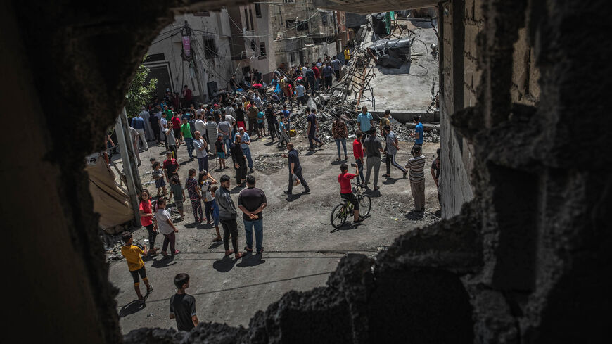 Palestinians inspect damage to buildings in Gaza City on May 20, 2021 in Gaza City, Gaza. 