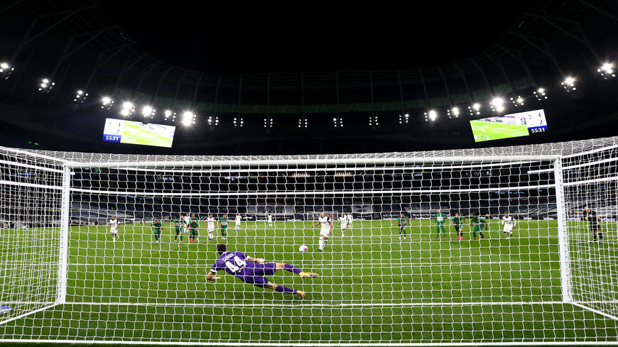 Harry Kane of Tottenham Hotspur scores his team's fifth goal from the penalty spot during the UEFA Europa League playoff match between Tottenham Hotspur and Maccabi Haifa at Tottenham Hotspur Stadium, London, United Kingdom, Oct. 01, 2020.