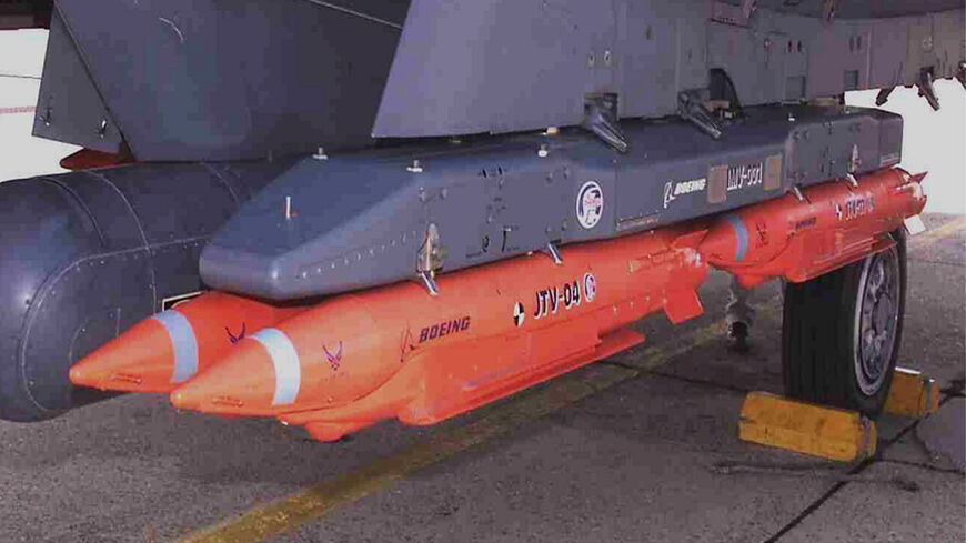 Four 250-pound class GBU-39/B guided weapons are seen mounted on a USAF F-15E on Aug. 14, 2003, at Eglin Air Force Base, Florida. GBU-39s are part of an arms package for Israel that some progressive Democrats are opposing.