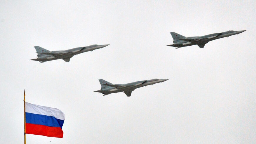 Russian Tupolev Tu-22M supersonic strategic bombers fly above the Kremlin in Moscow, on May 7, 2014, during a rehearsal of the Victory Day parade.