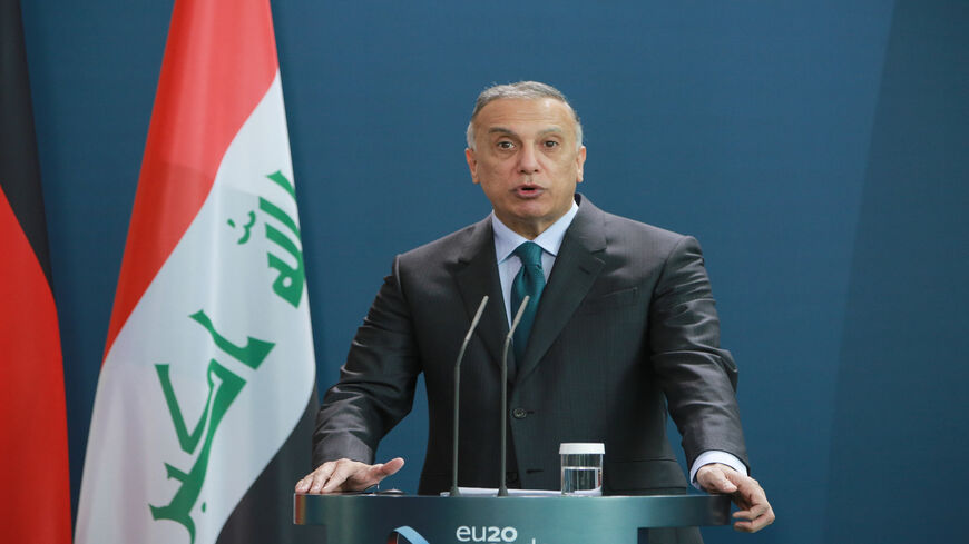 Iraqi Prime Minister Mustafa al-Kadhimi speaks to the media during a press conference with German Chancellor Angela Merkel at the Chancellery, Berlin, Germany, Oct. 20, 2020.