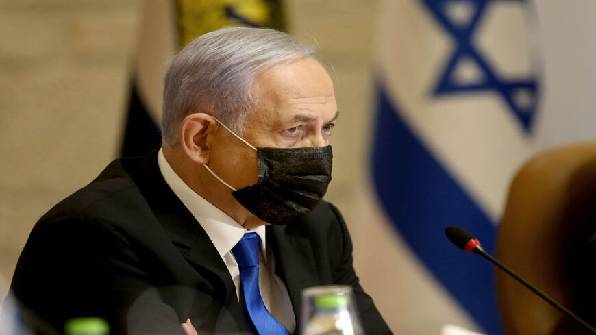 Israeli Prime Minister Benjamin Netanyahu, wearing a mask for protection against the coronavirus, attends a special Cabinet meeting on the occasion of Jerusalem Day at the city's municipality building, Jerusalem, May 9, 2021.