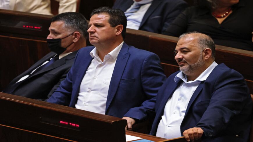 Israeli Knesset members (L to R) Gideon Saar, head of Israel's New Hope party, Ayman Odeh, leader of the predominantly Arab Joint List and the Hadash party, and Mansour Abbas, head of the conservative Islamic Raam party, attend a special session at the parliament in Jerusalem, on June 13, 2021.