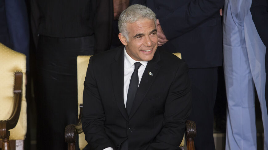 Israeli Foreign Minister Yair Lapid attend a traditional group photo with minsters of the new Israeli government on June 14, 2021 in Jerusalem.