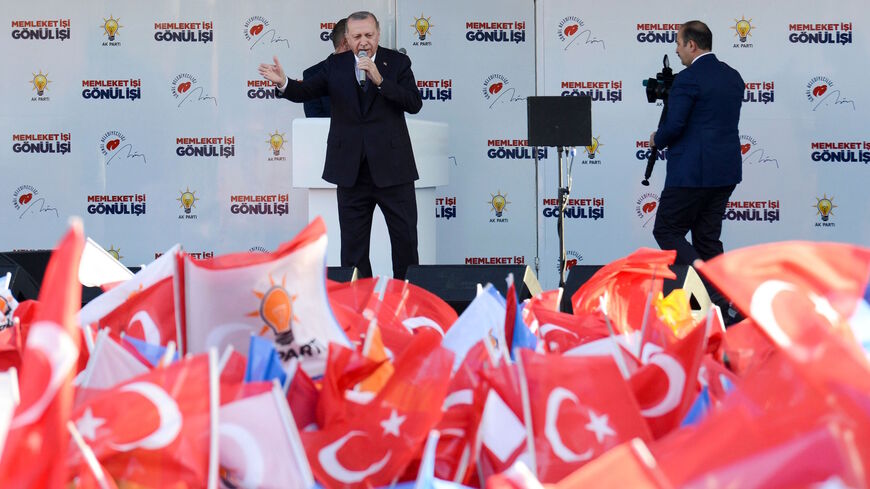 Turkish President Recep Tayyip Erdogan speaks on stage during a local election rally of his Justice and Development Party (AK Party) in Diyarbakir, eastern Turkey, on March 9, 2019. 