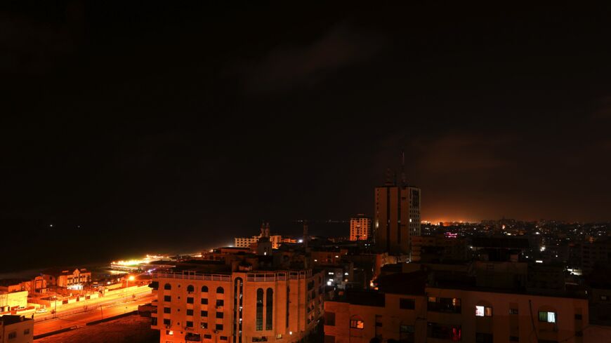 A picture taken early on July 26, 2021, shows a view of Gaza city at night.