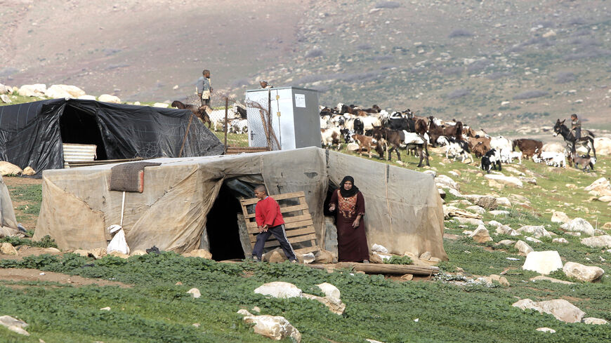 Palestinian Bedouins prepare to evacuate as the Israeli army readies to carry out military exercises in the Wadi al-Maleh area, in the north of the Jordan Valley, West Bank, Jan. 2, 2013.