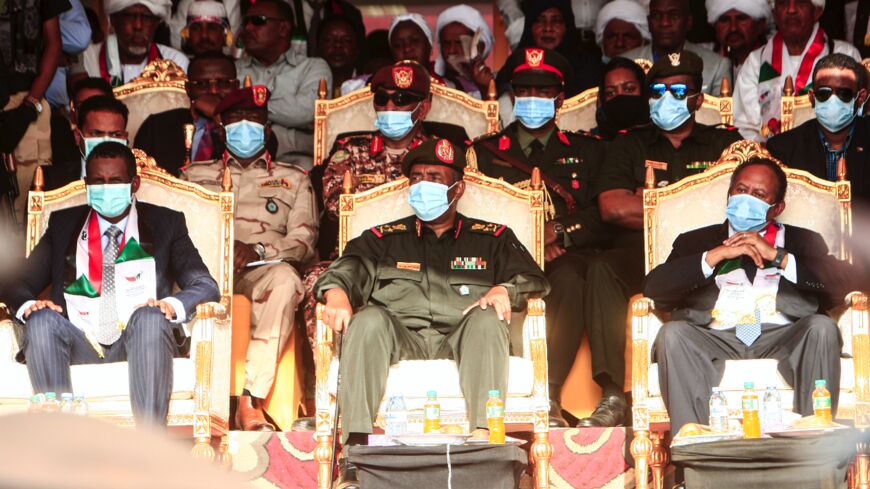 (L to R front row) Gen. Mohamed Hamdan Daglo "Hemeti", deputy chairman of Sudan's Sovereignty Council, council chief General Abdel Fattah al-Burhan, and Prime Minister Abdalla Hamdok.