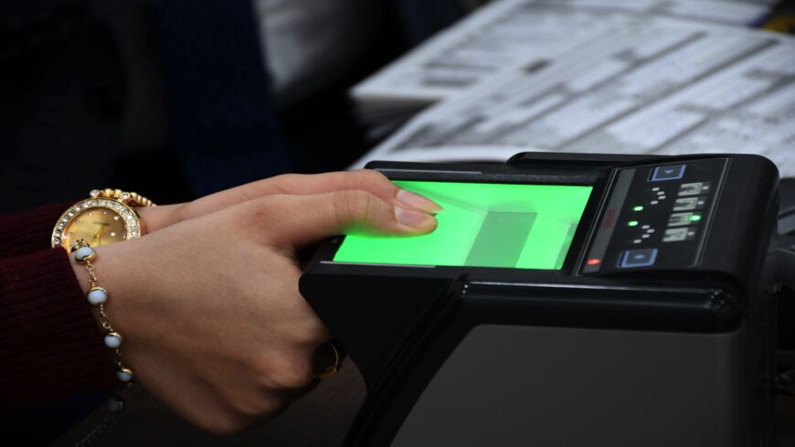 An Iraqi woman updates her voter registration at the Independent High Electoral Commission Center in the southern Iraqi city of Nasiriyah in the Dhi Qar province on Jan. 12, 2021.