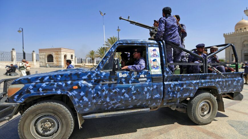 Forces loyal to Yemen's Houthi rebels guard the area around Sanaa's Al-Saleh mosque.