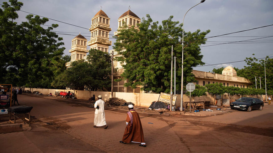 Muslim worshippers head to prayer in the Badalabougou neighborhood of Bamako during the Muslim holiday of Eid al-Adha, Mali, July 20, 2021.