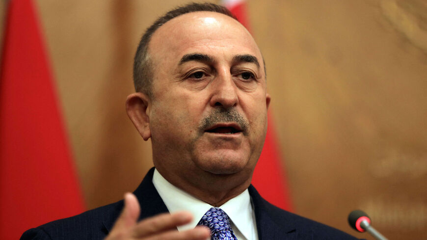 Turkish Foreign Minister Mevlut Cavusoglu gives a joint press conference with his Jordanian counterpart at the foreign ministry headquarters in Amman on August 17, 2021. 