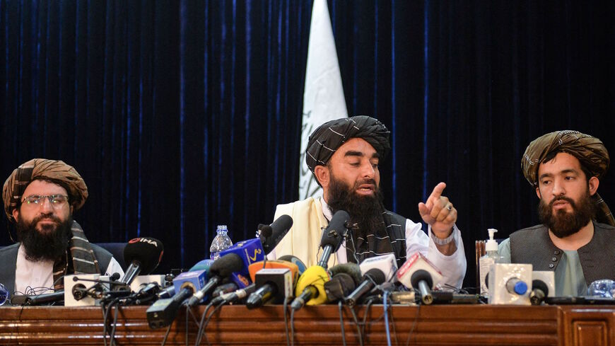 Taliban spokesperson Zabihullah Mujahid (C) gestures as he addresses the first press conference in Kabul on Aug. 17, 2021 following the Taliban stunning takeover of Afghanistan. 