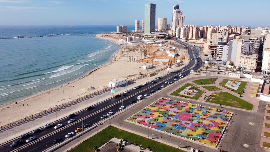 An aerial image shows a picnic tables at a recreational area, built on the former military academy of late Libyan leader Moamer Kadhafi's entourage of female bodyguards, known as "Amazons", between the port and the city centre of the capital Tripoli, on June 8, 2021.