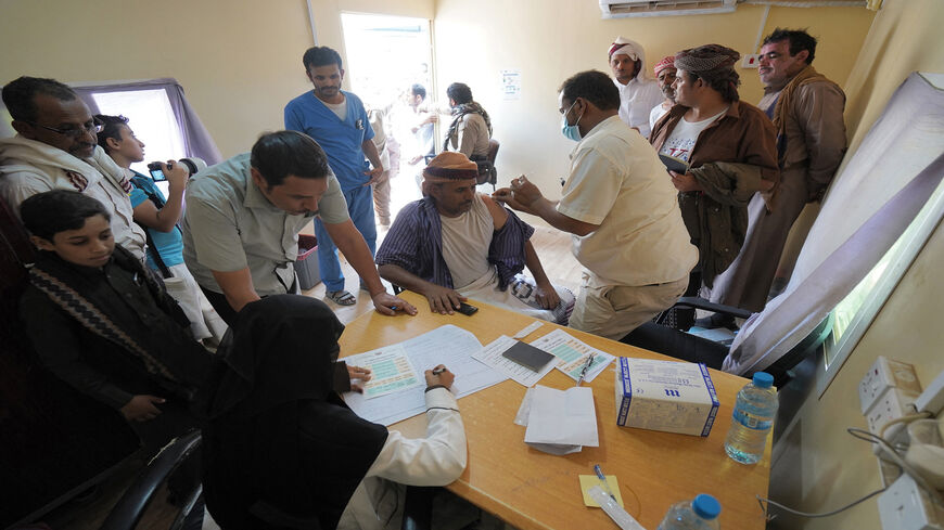 A man receives a dose of the Oxford-AstraZeneca coronavirus vaccine at a vaccination center on the outskirts of Marib province, Yemen, July 7, 2021.