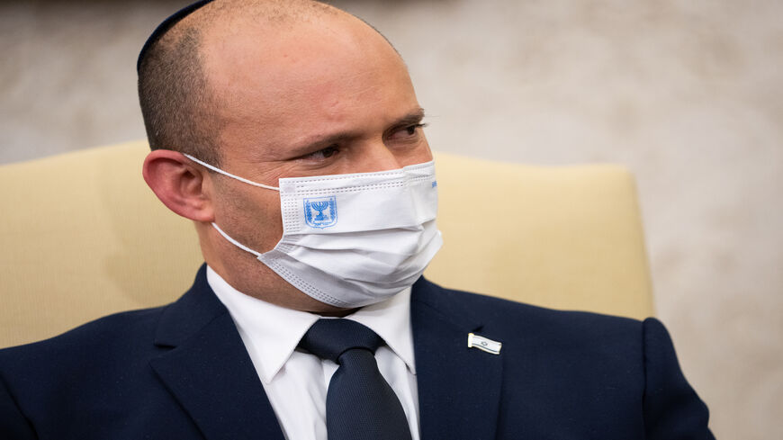 Israeli Prime Minister Naftali Bennett listens during a meeting with US President Joe Biden in the Oval Office at the White House, Washington, Aug. 27, 2021.