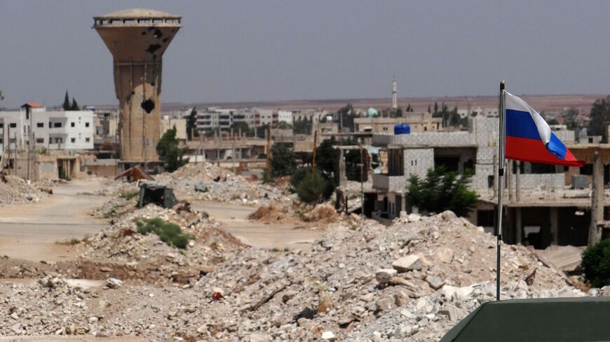 A picture shows a Russian flag on a Russian military vehicle in the Syrian district of Daraa al-Balad in Syria's southern province of Daraa, on Sept. 1, 2021. 