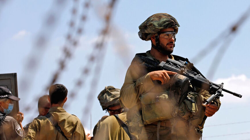 Israeli security forces patrol along the security fence in the village of Muqeibila near the West Bank town of Jenin on Sept. 6, 2021, following the escape of six Palestinians from an Israeli prison.