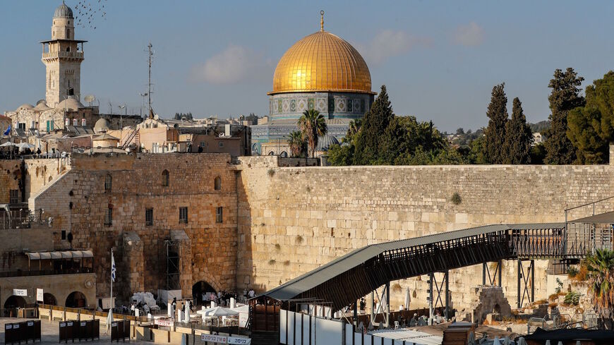 This picture shows the Mughrabi ramp, leading from the Western Wall (Wailing Wall) to the Al-Aqsa Mosque compound that includes the Dome of the Rock Mosque (background) in Jerusalem's Old City, on Sept. 10, 2021. 