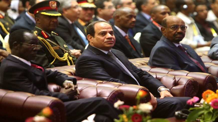 South Sudan's Vice President James Wani Igga (L), Egyptian President Abdel-Fattah al-Sisi (C) and Sudanese President Omar al-Bashir attend a meeting in the Sudanese capital, Khartoum, on March 23, 2015.