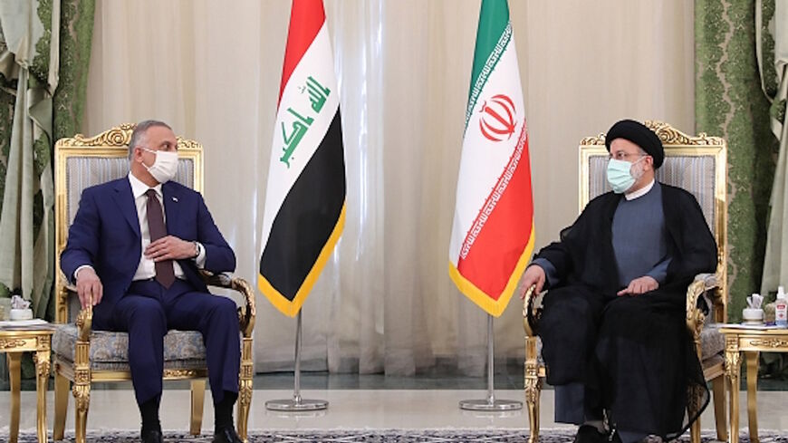 Iranian President Ebrahim Raisi (R) and Iraqi Prime Minister Mustafa al-Kadhimi (L) hold a joint press conference in Tehran, Iran, Sept. 12, 2021.