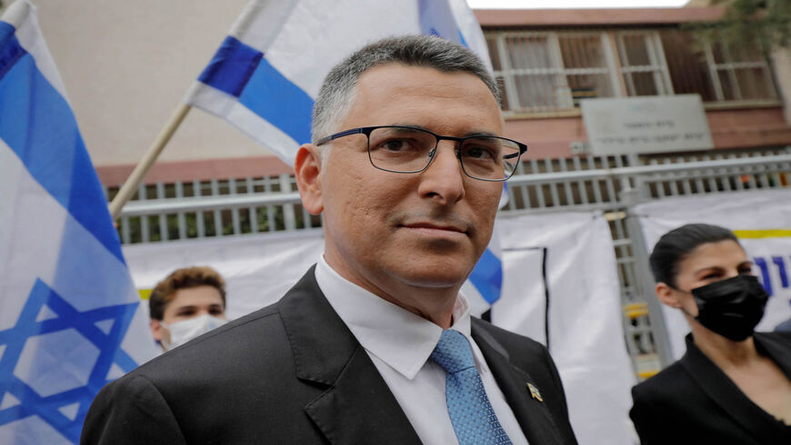 Gideon Saar, chairman of the New Hope party, and his wife Geula are pictured outside a polling station, in the country's fourth national election in two years, Tel Aviv, Israel, March 23, 2021.