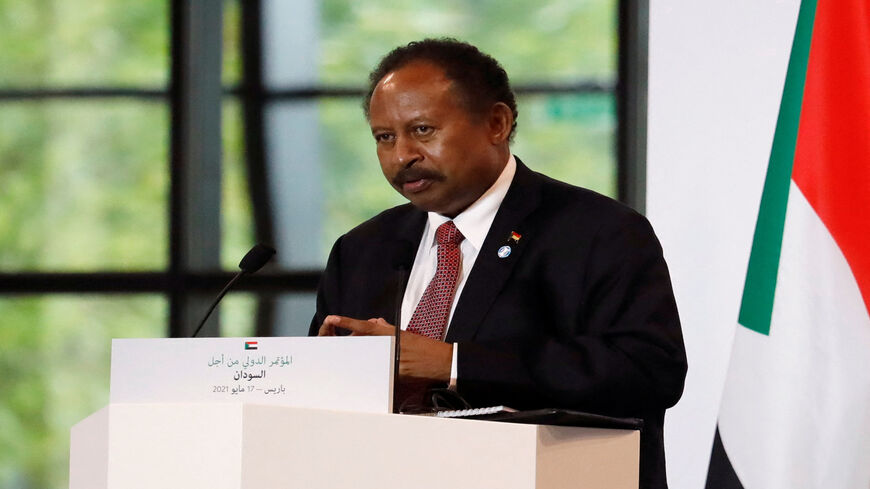 Sudan's Prime Minister Abdalla Hamdok gives a press conference with French President Emmanuel Macron during the International Conference in support of Sudan at the temporary Grand Palais, Paris, May 17, 2021.