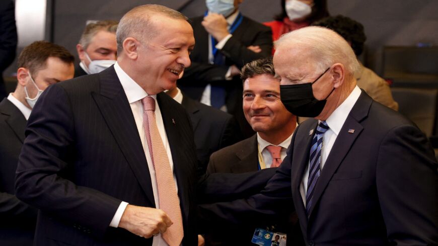 US President Joe Biden (R) speaks with Turkey's President Recep Tayyip Erdogan.