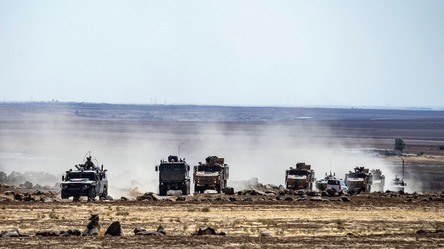 Turkish and Russian military vehicles patrol in the countryside of Rumaylan (Rmeilan) in Syria's northeastern Hasakeh province near the Turkish border, on Sept. 16, 2021. 