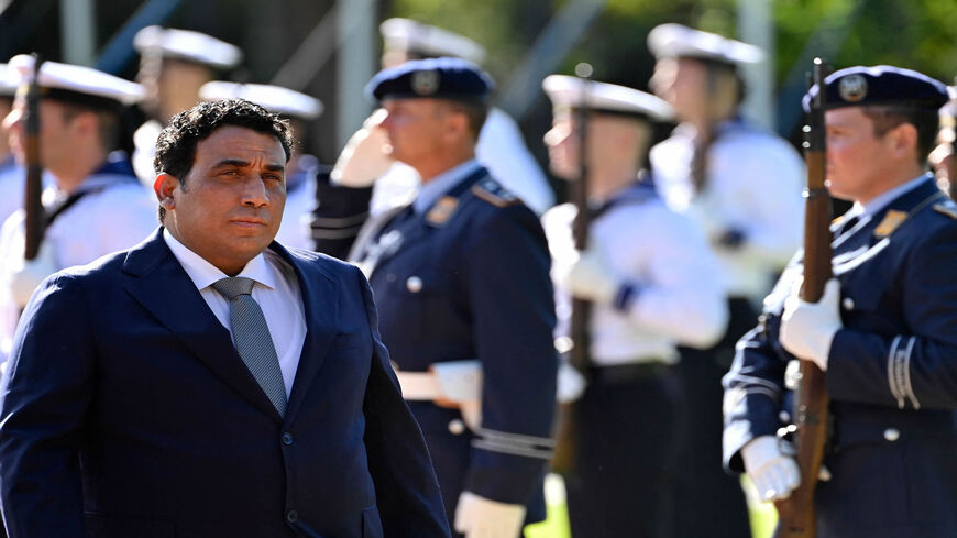 Libya's President Mohammad Younes Menfi (L) is pictured as he reviews a guard of honor during his meeting with German President Frank-Walter Steinmeier at the Bellevue presidential palace, Berlin, Germany, Oct. 1, 2021.