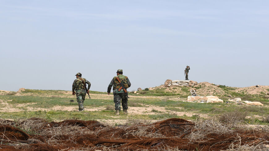 Syrian government forces patrol the northern town of Tel Rifaat, Syria, March 28, 2018.