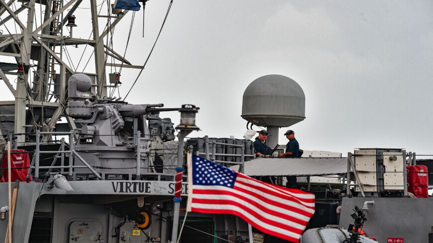 US Navy sailors stand guard aboard the USS Sirocco patrol ship while docked at the US 5th Fleet Command in Bahrain's capital, Manama, on Dec. 17, 2019. 