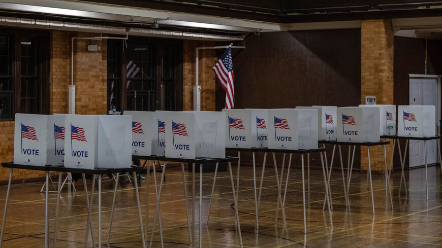 Empty voting booths are seen in Flint, Michigan at the Berston Fieldhouse polling place on Nov. 3, 2020.