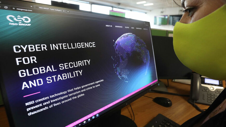 A woman checks the website of Israel-made Pegasus spyware at an office in Nicosia, Cyprus, July 21, 2021.