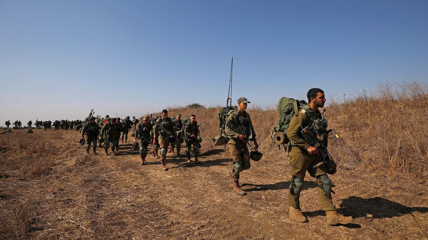 Israeli soldiers of the Nahal Brigade take part in a drill near the settlement of Kidmat Tsvi in the Israel-annexed Golan Heights, on Oct. 27, 2021. 